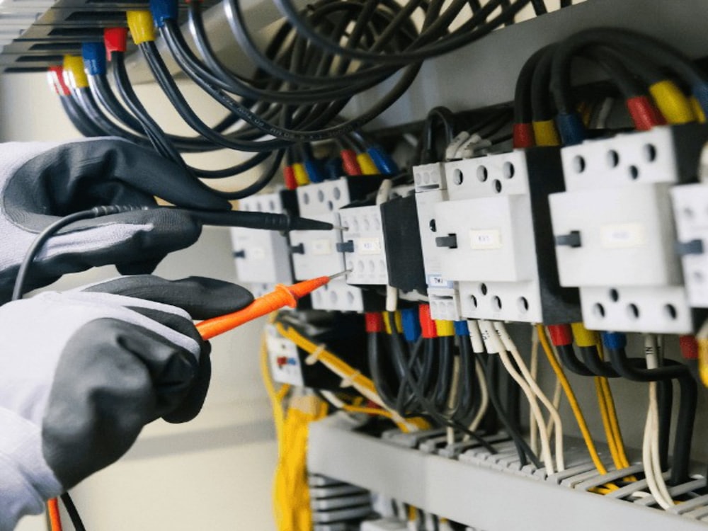 Electrician carrying out electrical installation work